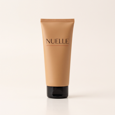 NUELLE Body Perfector body makeup tube in Medium caramel shade