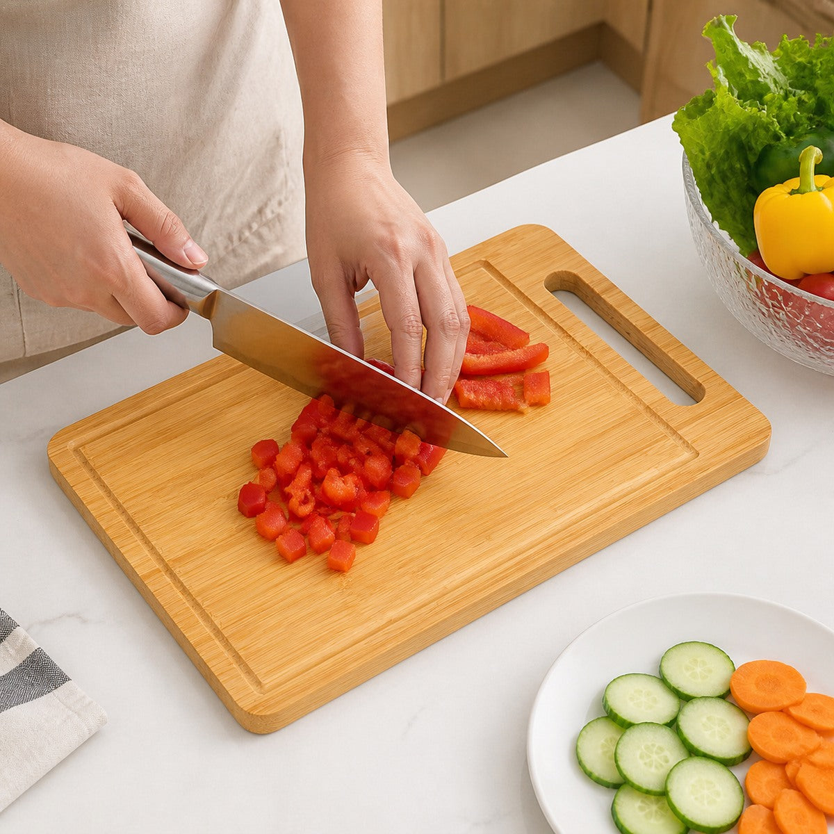 Vegetables being chopped on a Groovewell bamboo board