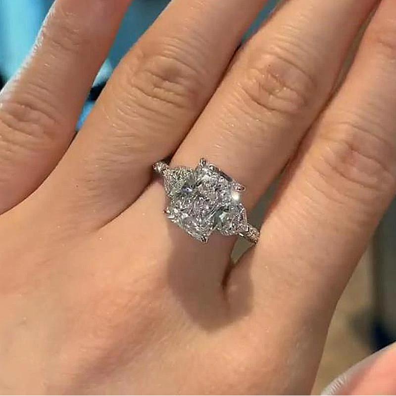 Radiant Cut Three Stone Engagement Ring With Two Heart Cut Side Stones shine of diamond