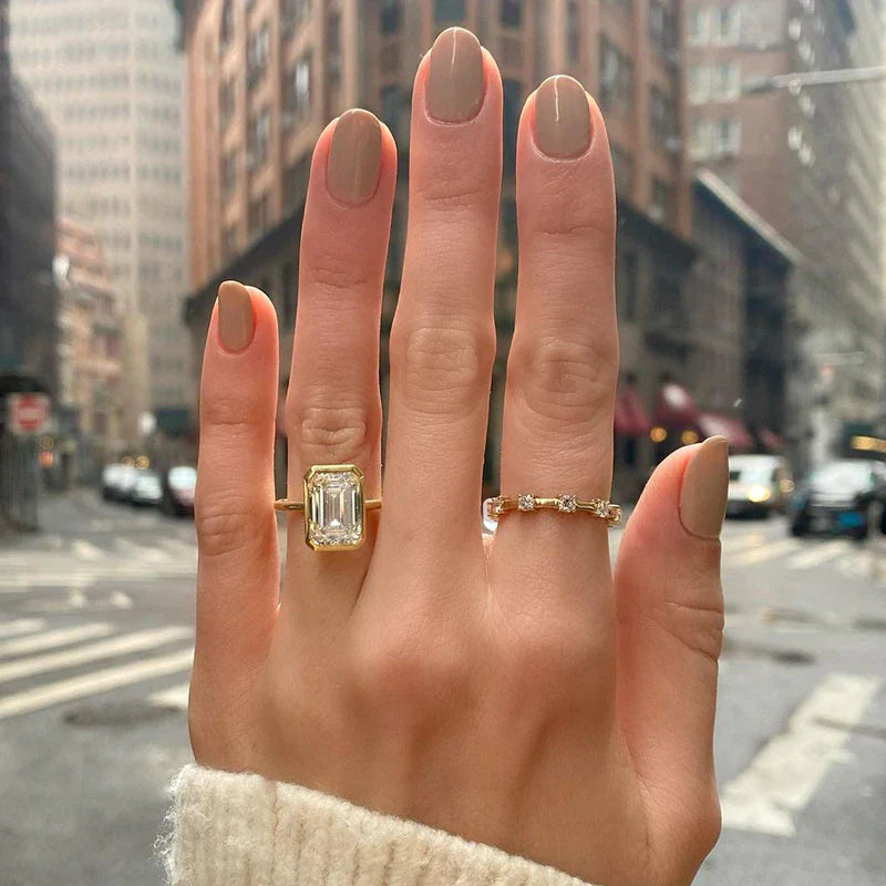 Elegant Emerald Cut Sterling Silver Bezel Engagement Ring In Golden Tone Shineofdiamond