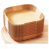 Crispguard square parchment liner stack on a clean white background
