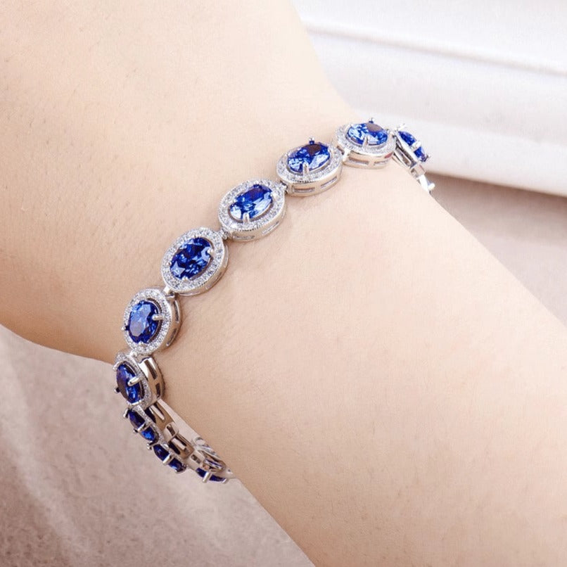 Oval Cut Sapphire Tennis Bracelet in Sterling Silver Shineofdiamond