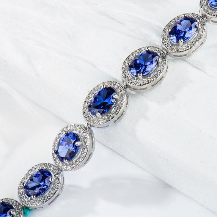 Oval Cut Sapphire Tennis Bracelet in Sterling Silver Shineofdiamond