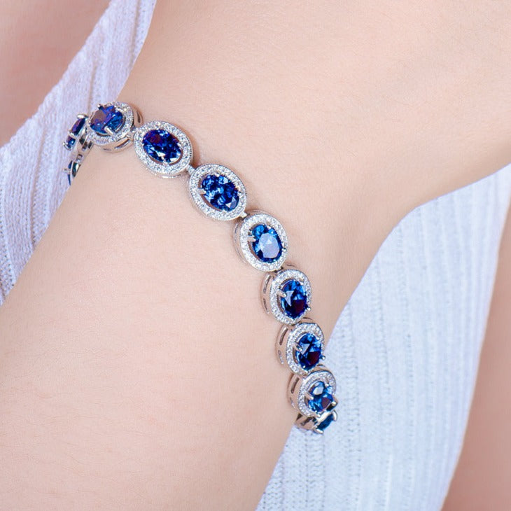 Oval Cut Sapphire Tennis Bracelet in Sterling Silver Shineofdiamond