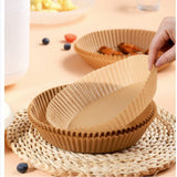 Crispguard liner being placed in an air fryer basket