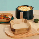 Crispguard square parchment air fryer liner with food