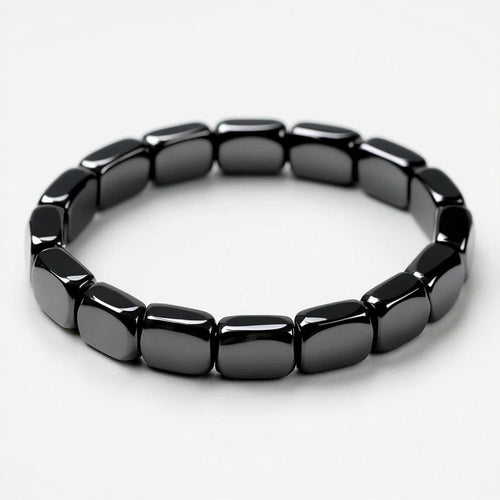 Dravyn hematite bracelet, tile-cut beads on stretch cord, isolated on white