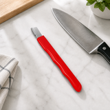 EdgeSharp corrected head geometry on a kitchen marble counter beside a chef knife