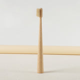 Gumcrest tan natural-bristle toothbrush front view