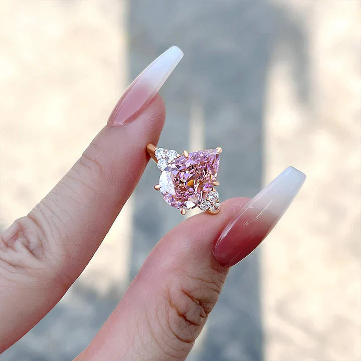 Pear Cut Pink Gemstone Three Stone Engagement Ring In Sterling Silver shine