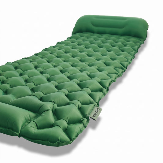 Valtro TrailRest sleeping pad shown fully unrolled with integrated pillow, forest green