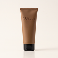 NUELLE Body Perfector body makeup tube in Tan bronze shade