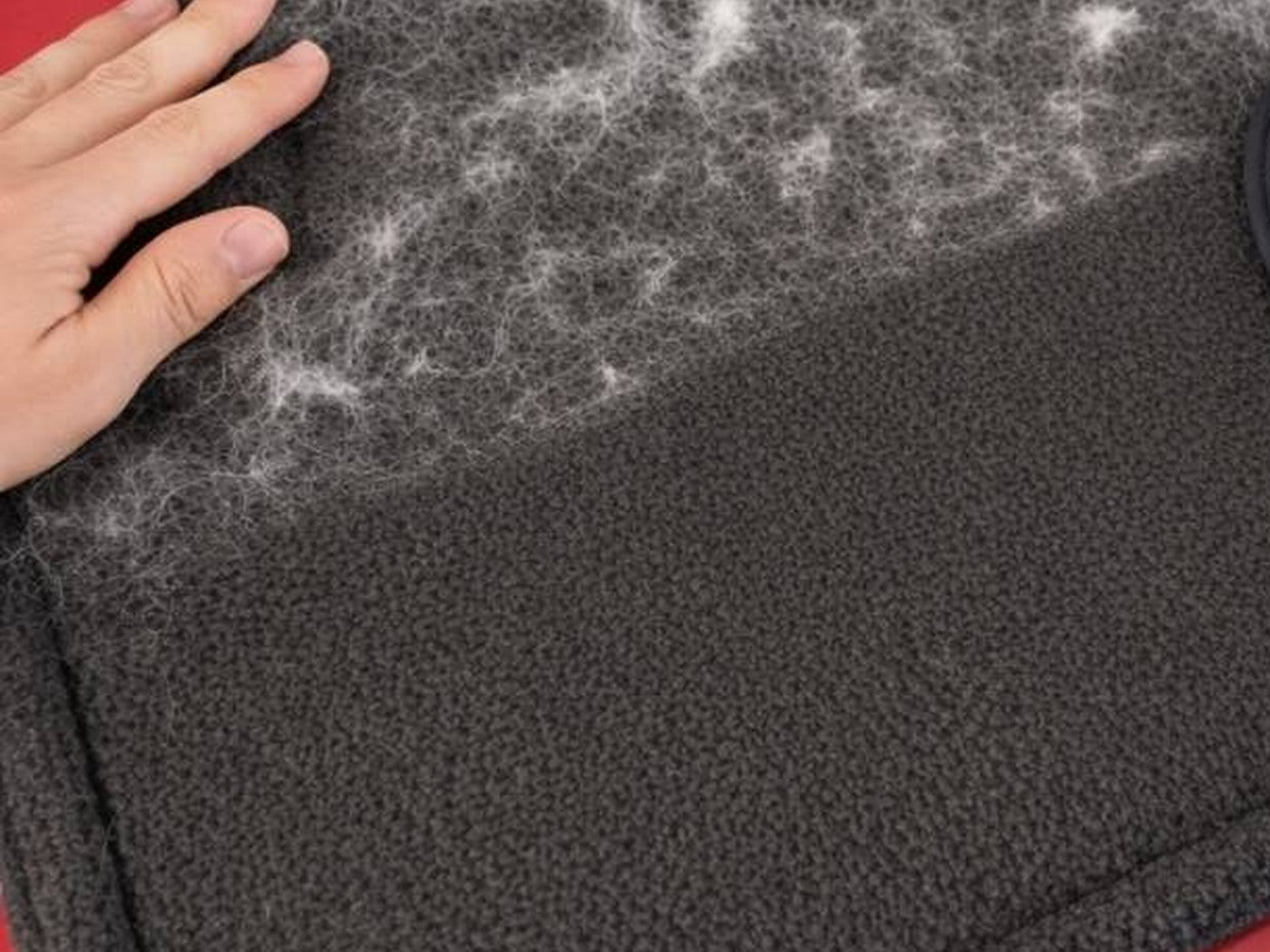 Furvia glove on laundry fabric with pet hair