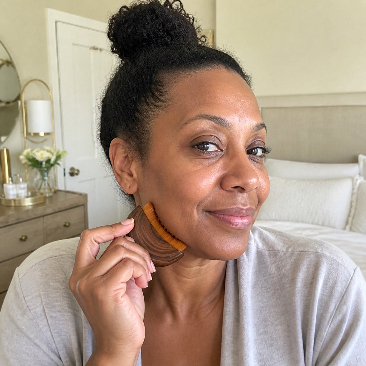 Customer using the brown crescent brush in her morning routine