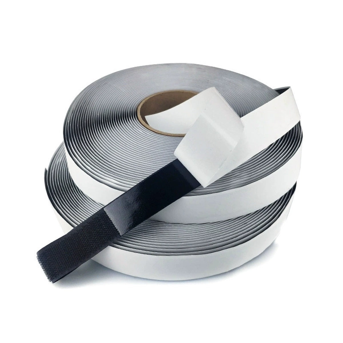 Griploop adhesive backing being peeled from a roll