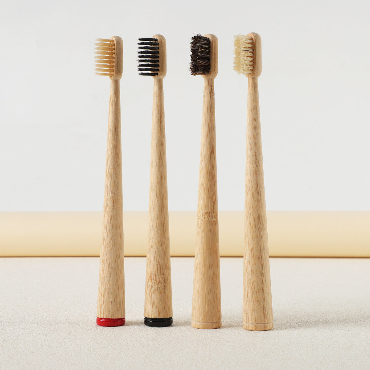 Gumcrest pig-hair bristle toothbrush held near a sink