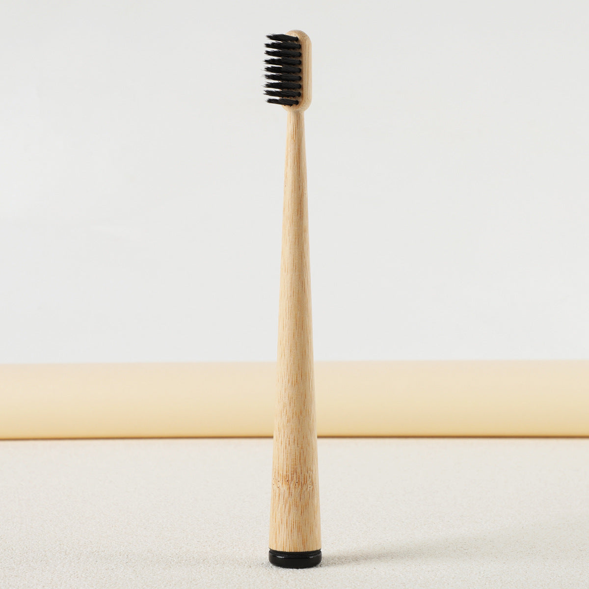 Gumcrest toothbrushes in a clear bathroom cup