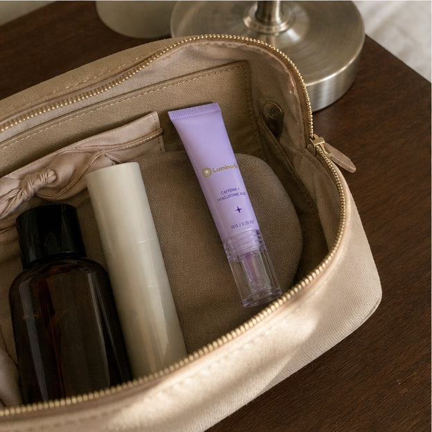Representative travel pouch scene with the compact Luminorb roller tube