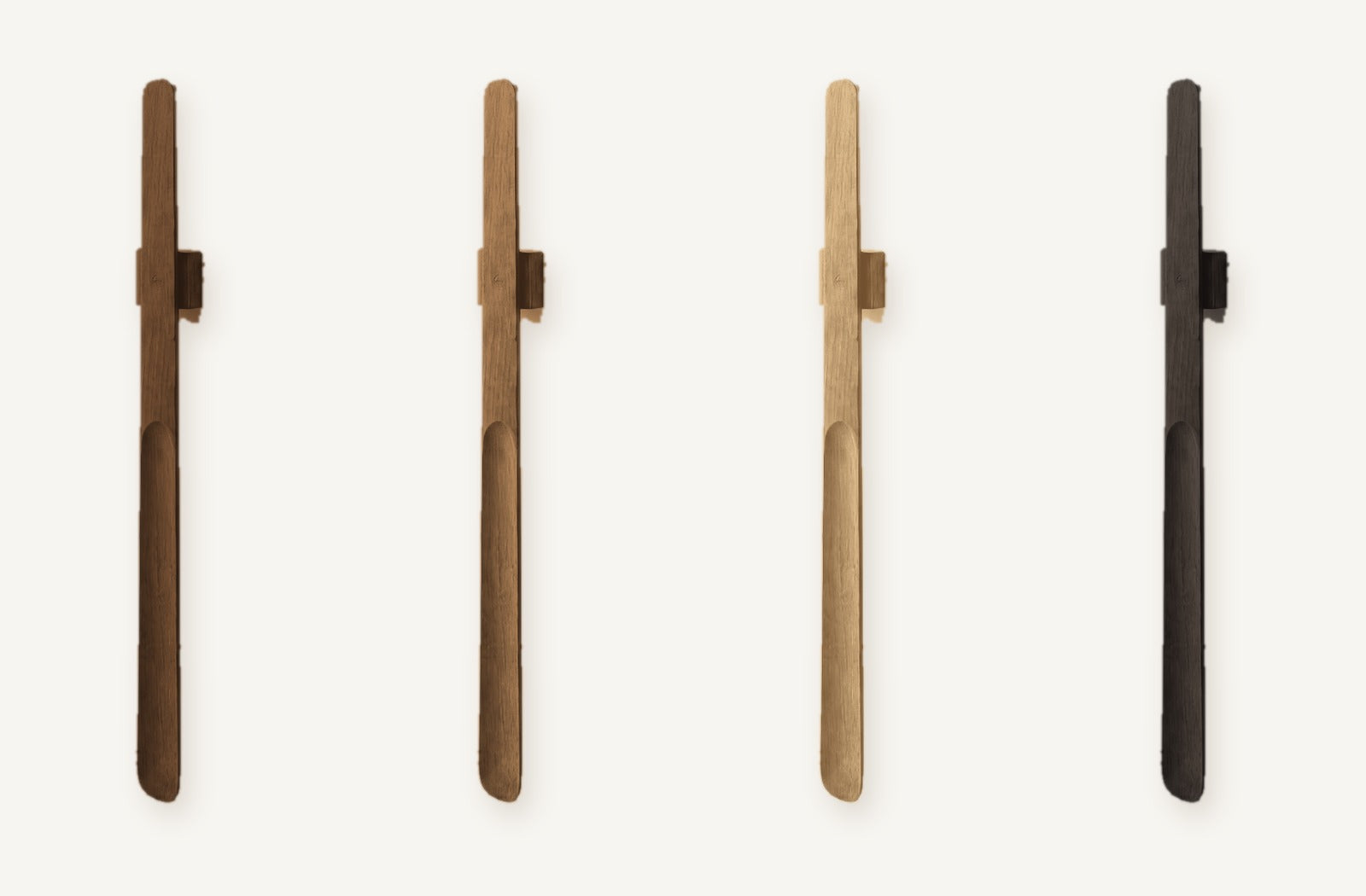 Norlund magnetic shoehorn shown in all four finishes side by side: Dark Oak, Walnut, Light Oak and Black