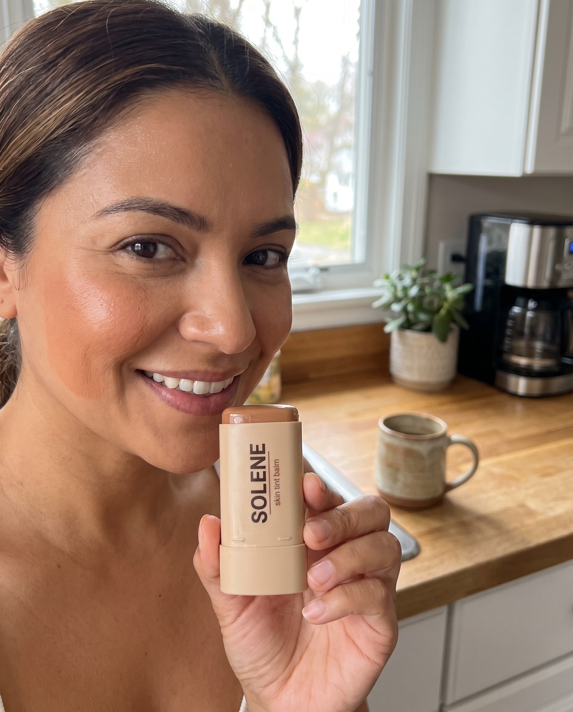 Model wearing a soft skin tint finish